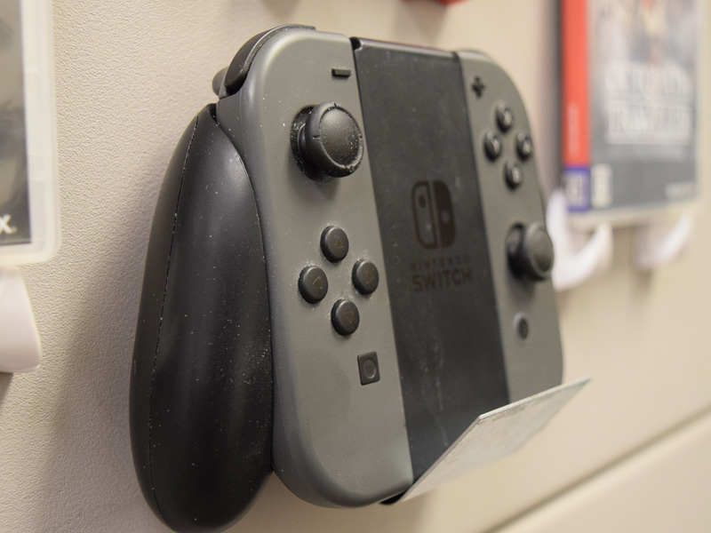 Switch controller hanging on wall with sheet steel and rubber magnet