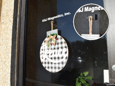 Holiday decoration hanging on a glass door with rubber magnet