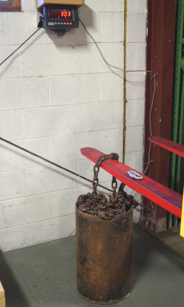 Forklift used to weigh very heavy metal object