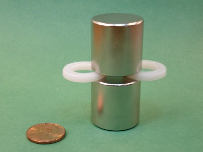 Two cylinder magnets with plastic separators in between