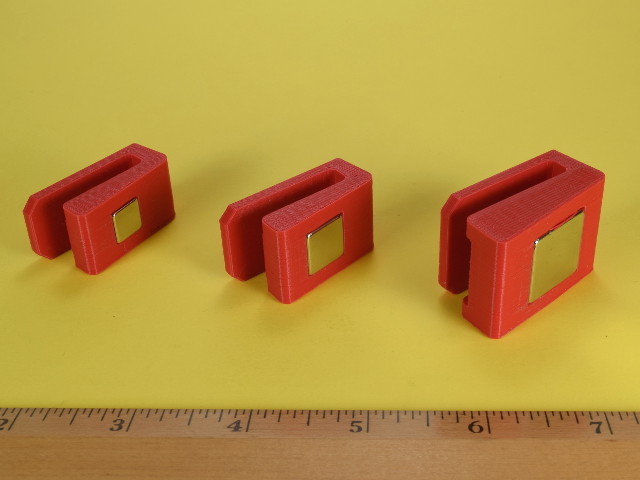 Different sizes of magnets in clips