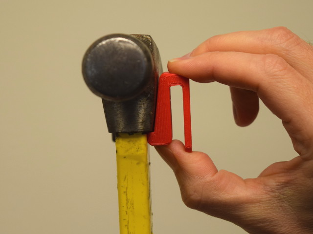 Magnet clip installed on a hammer
