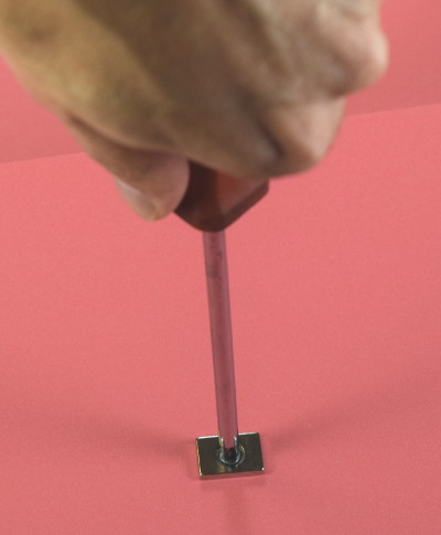Tightening a screw into magnet