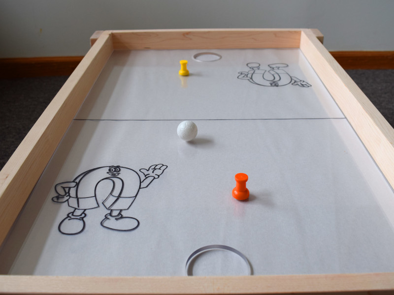 Long view of magnetic hockey table