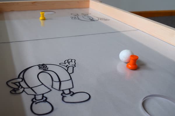 Magnetic hockey table