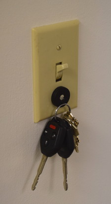 Keys hung on light switch with magnets