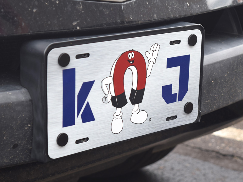 Magnets securing license plate