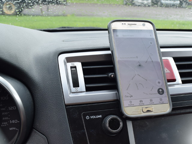 Smart phone mounted to dash with magnets