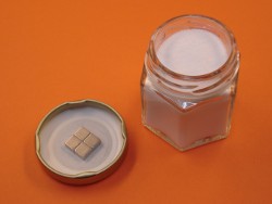 Four magnets on spice jar lid
