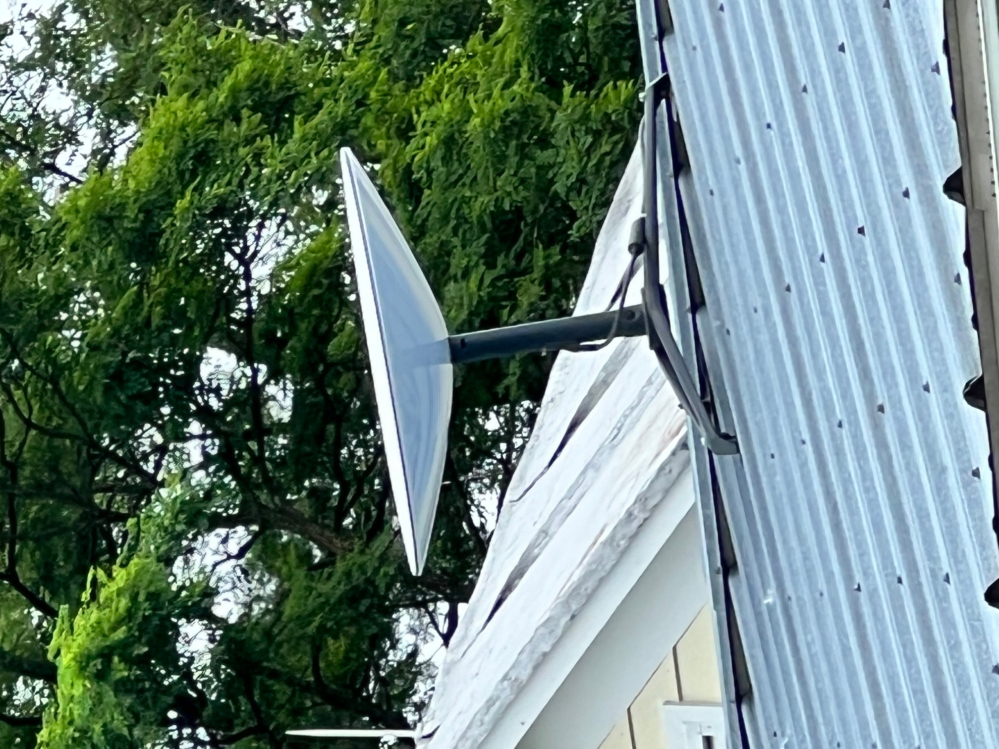Satellite dish stuck to metal roof with magnets