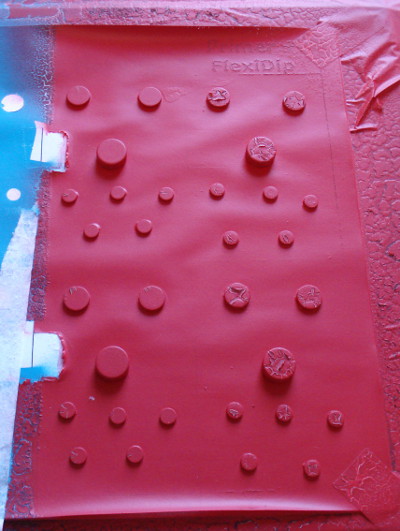 Many magnets coated in red rubber