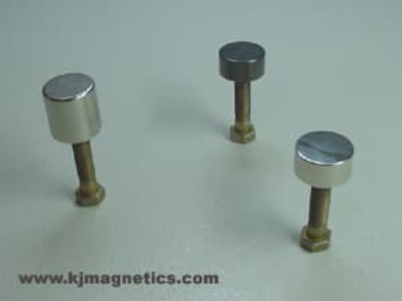 Magnets prepared to dip with bolt and bottle cap attached