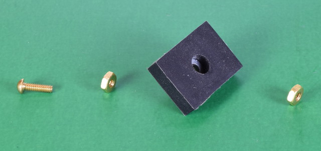 Rubber mounting magnet and nuts and a bolt