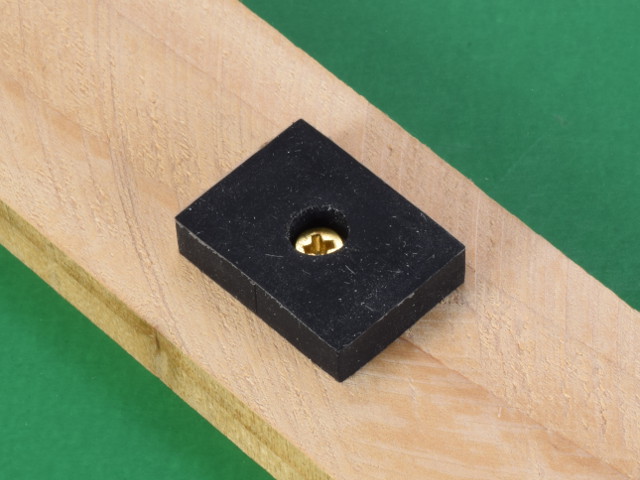 Rubber mounting magnet attached to wood with screw