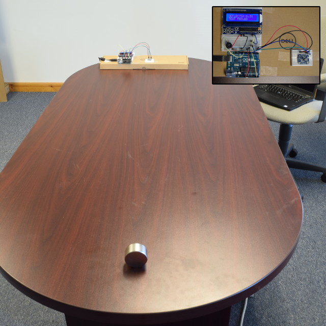 Magnet on opposite side of table from sensors