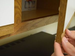 Adding a magnet to kitchen cabinet for secure door and cabinet closures