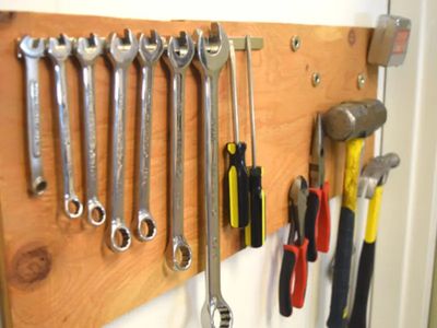 Magnets holding and organizing tools on a wall