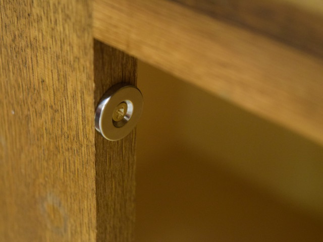 Countersunk magnet installed on cabinet frame