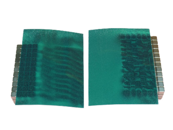 Green sheet of magnetic film to view magnetic fields of magnets