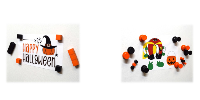 Black and orange plastic block and pushpin halloween decorative fridge magnets holding photos on refrigerator